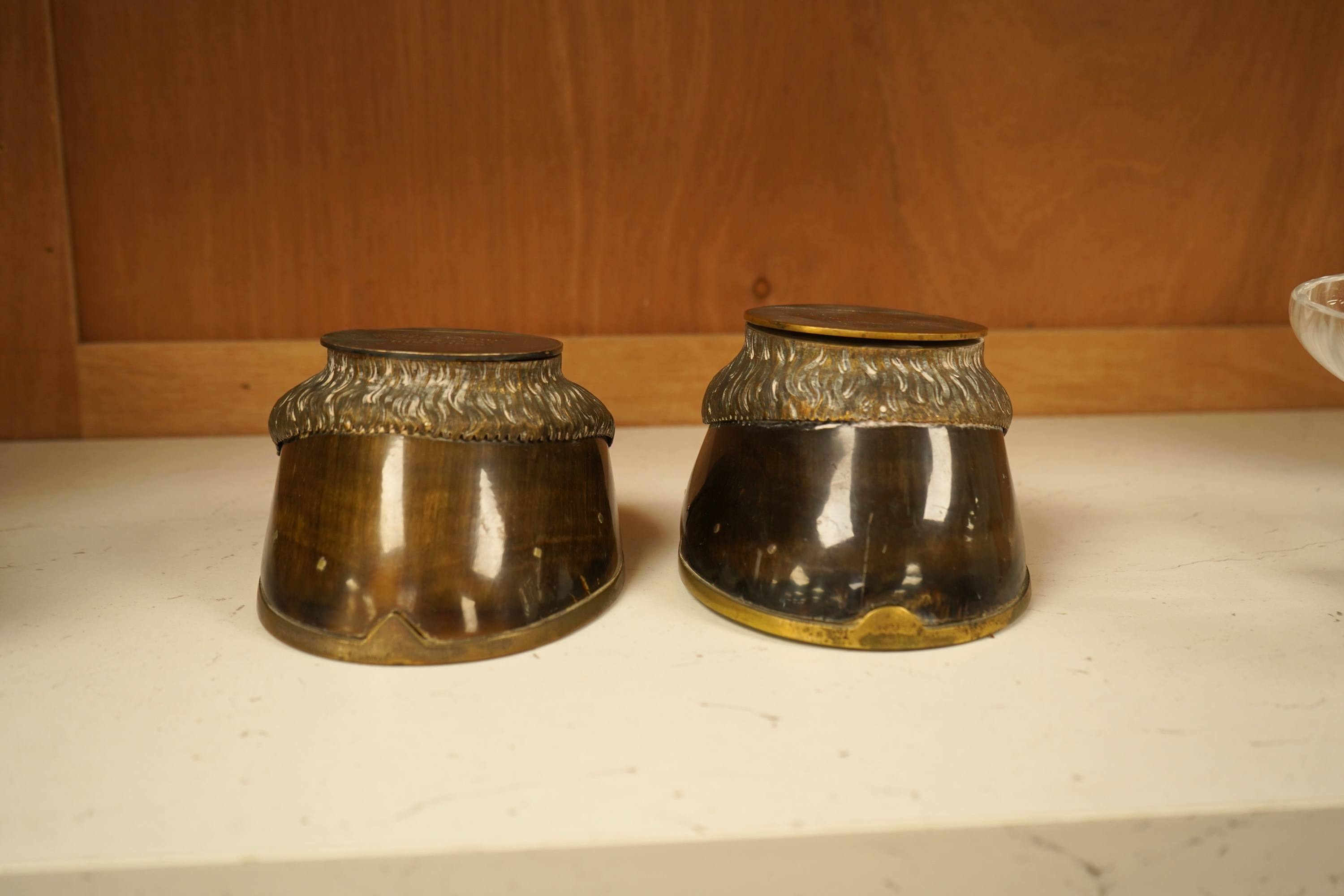 Two Victorian taxidermic horse hoof inkwells with inscriptions to the lids, 13cm wide